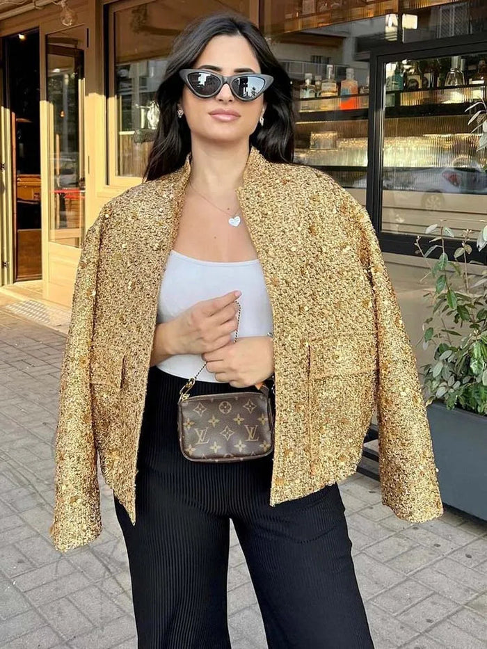Oversized jasje met gouden pailletten